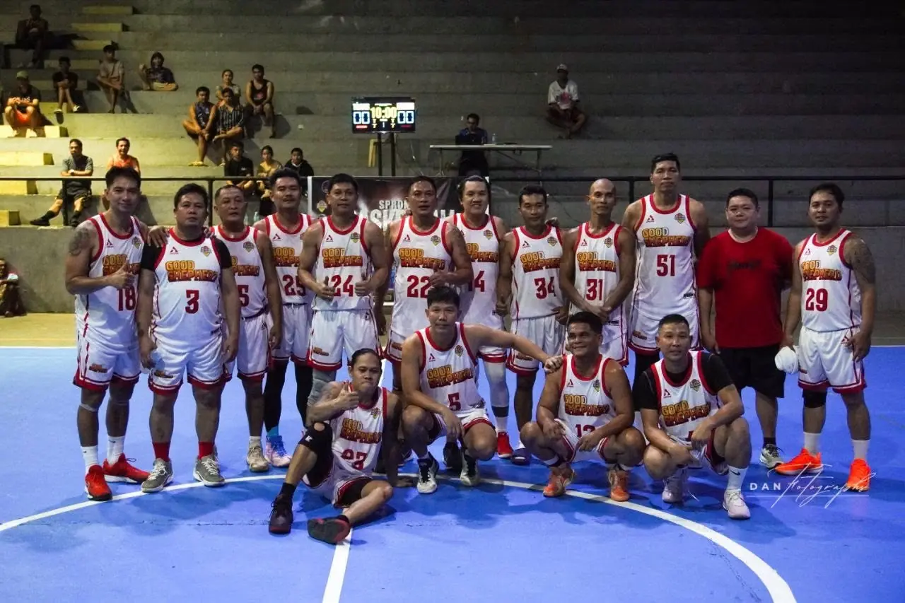 Basketball team in white uniforms at a community court